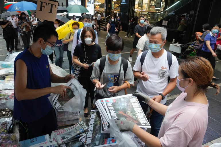 People queue up for last issue of Apple Daily at a newspaper booth at a downtown street in Hong Kong, Thursday, June 24, 2021. Vincent Yu–AP